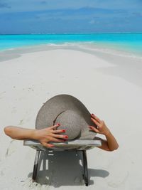 Woman in hat on beach