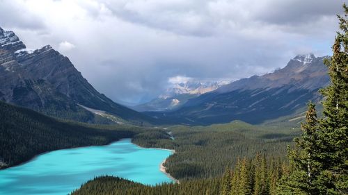 Scenic view of lake and mountains against sky