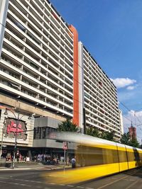 Blurred motion of train against sky in city