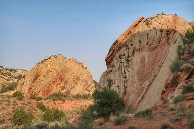 Rock formations on landscape against sky