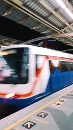 Blurred motion of illuminated railroad station platform