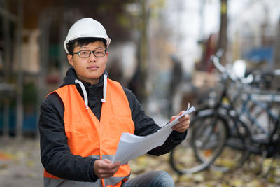 Portrait of engineer in reflective clothing outdoors