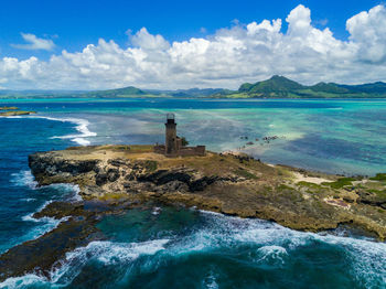 Scenic view of sea against cloudy sky