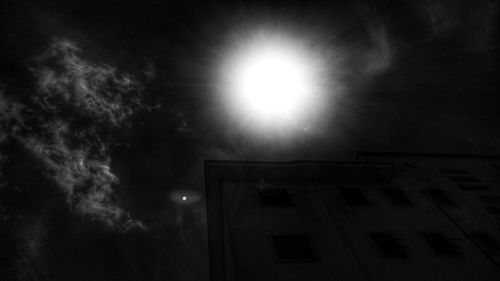 Low angle view of illuminated building against sky