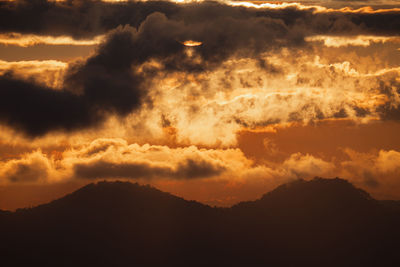 Low angle view of dramatic sky during sunset