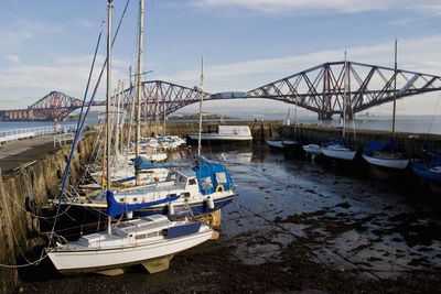 Boats moored at harbor
