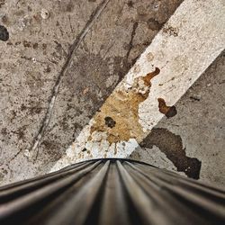 Surface level of old railroad tracks against wall