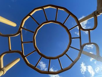 Low angle view of metallic structure against sky