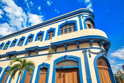 Low angle view of building against blue sky