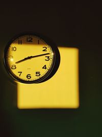 Close-up of clock on wall