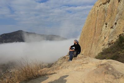 Full length of man on mountain against sky