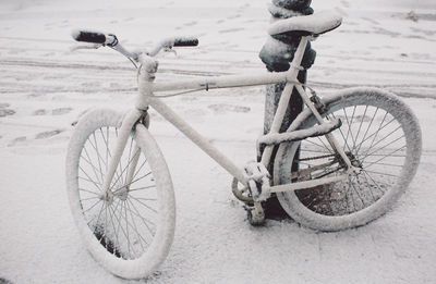 Bicycle parked on snow