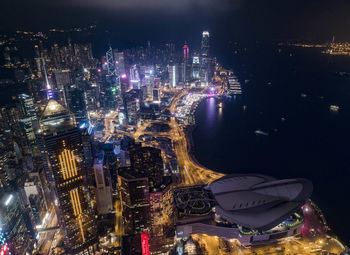 High angle view of illuminated buildings in city at night