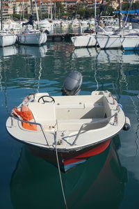 Boats moored at harbor