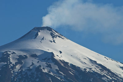 Scenic view of snow covered mountain against sky