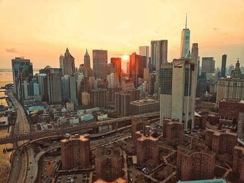 Aerial view of city buildings during sunset