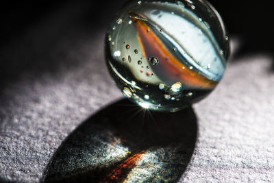 Close-up of water drop on table