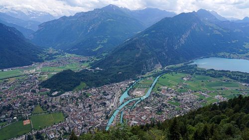 High angle view of land and mountains against sky