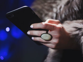 Close-up of man using mobile phone