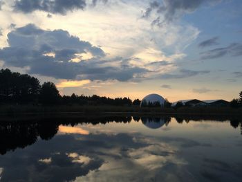 Scenic view of calm lake at sunset