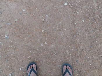 Low section of person standing on ground