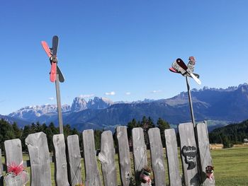 Traditional windmill on field against sky