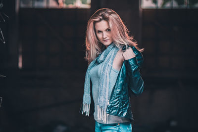 Portrait of young woman standing outdoors