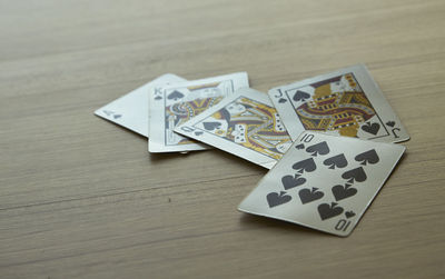 High angle view of cards on wooden table