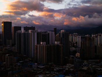 Cityscape against sky during sunset