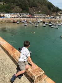 Full length of boy on sea shore