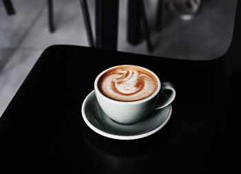 High angle view of cappuccino on table