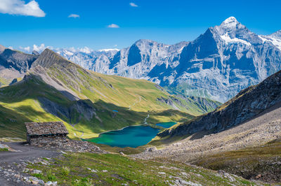 Scenic view of snowcapped mountains against sky