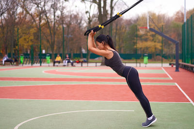 Side view of woman exercising