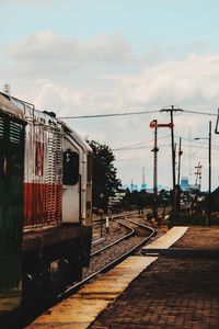 Train on railroad track against sky