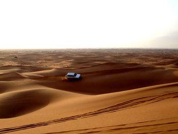 Scenic view of desert against clear sky