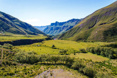 Scenic view of landscape and mountains against sky