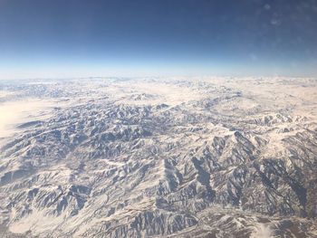 Aerial view of landscape against sky during winter