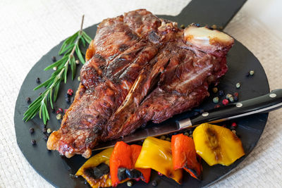 High angle view of meat on barbecue grill