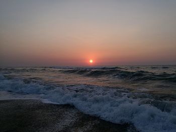 Scenic view of sea against clear sky during sunset