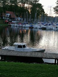 Boats moored in lake