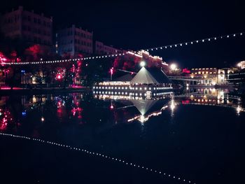 Illuminated buildings in city at night