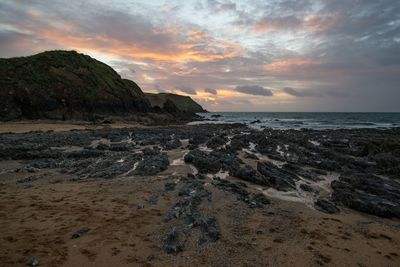 Scenic view of sea against sky at sunset