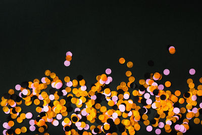 Defocused lights against sky at night