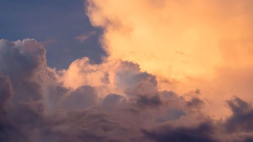 Low angle view of clouds in sky during sunset