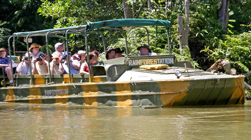 People sitting on boat in river