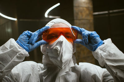 Portrait of man wearing protective workwear at site