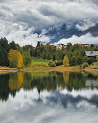 Beautiful autumn landscape with fog, cloudy sky and reflection lake in crans-montana, switzerland