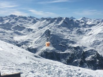 Scenic view of snowcapped mountains against sky