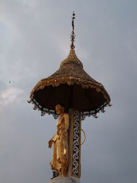 Traditional windmill against sky