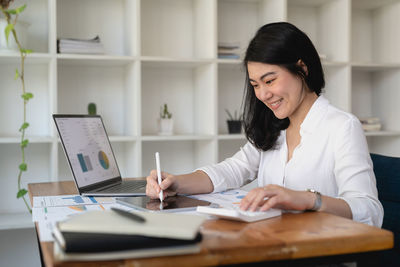 Businesswoman working on table